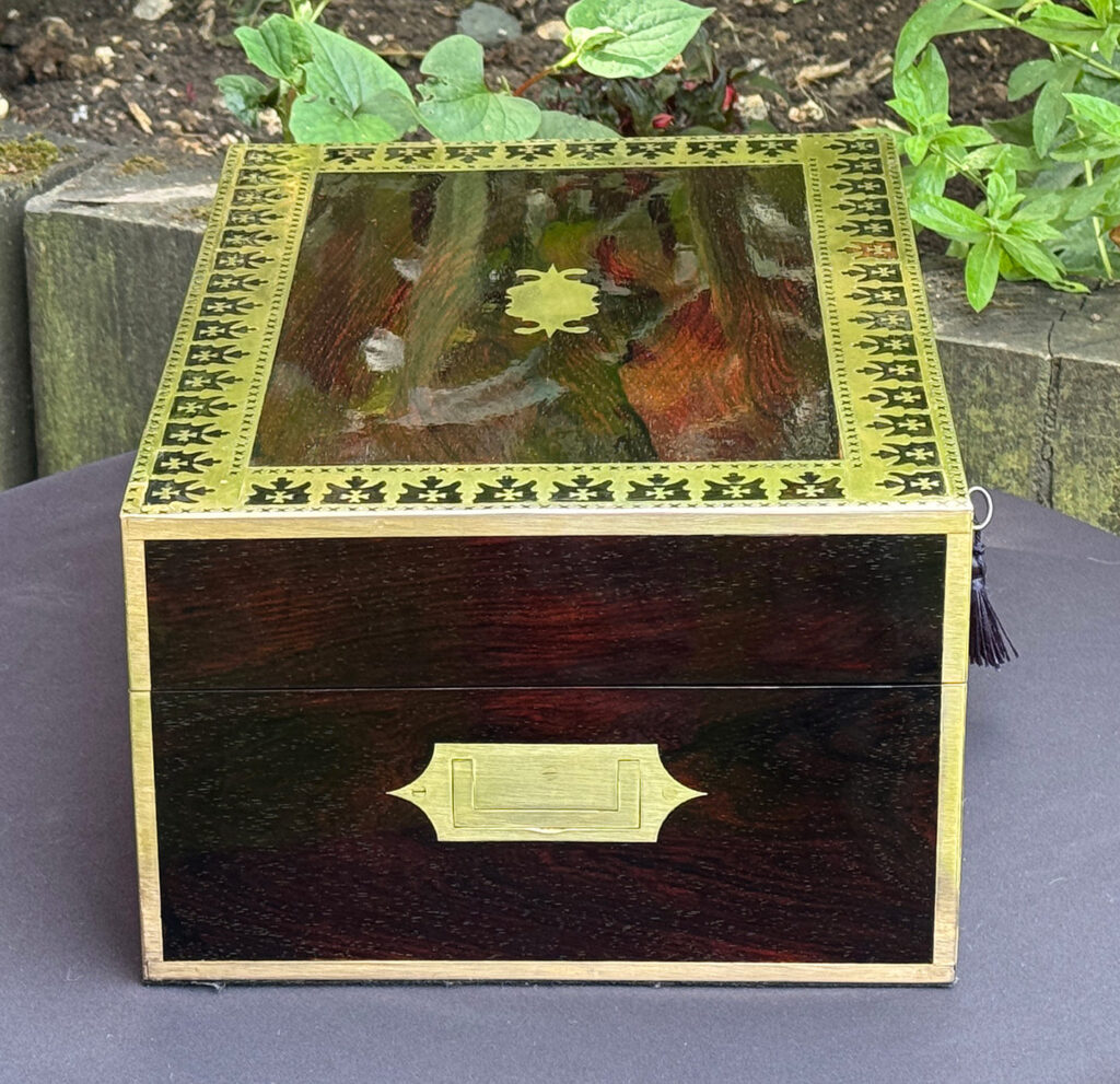 Left side view of an Antique Jewellery Box in Rosewood with Decorative Brass Inlay.