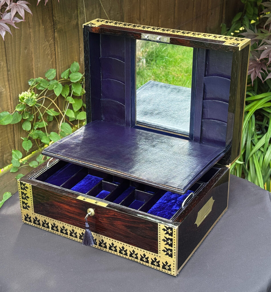 Front right internal view of an Antique Jewellery Box in Rosewood with Decorative Brass Inlay with mirror on display.