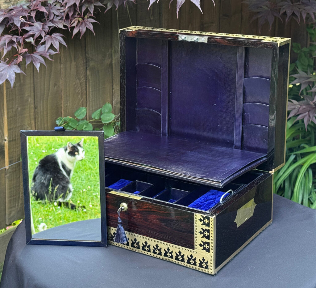 Front right open view of an Antique Jewellery Box in Rosewood with Decorative Brass Inlay with mirror freestanding.