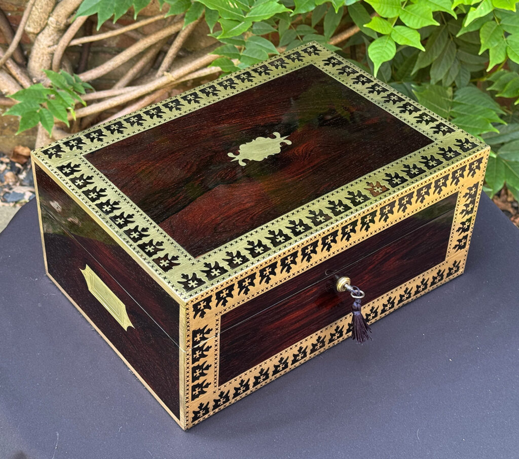 Front left overhead view of an Antique Jewellery Box in Rosewood with Decorative Brass Inlay.