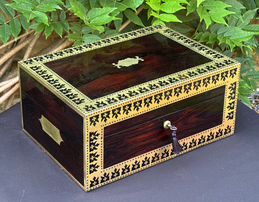 Front left view of an Antique Jewellery Box in Rosewood with Decorative Brass Inlay.