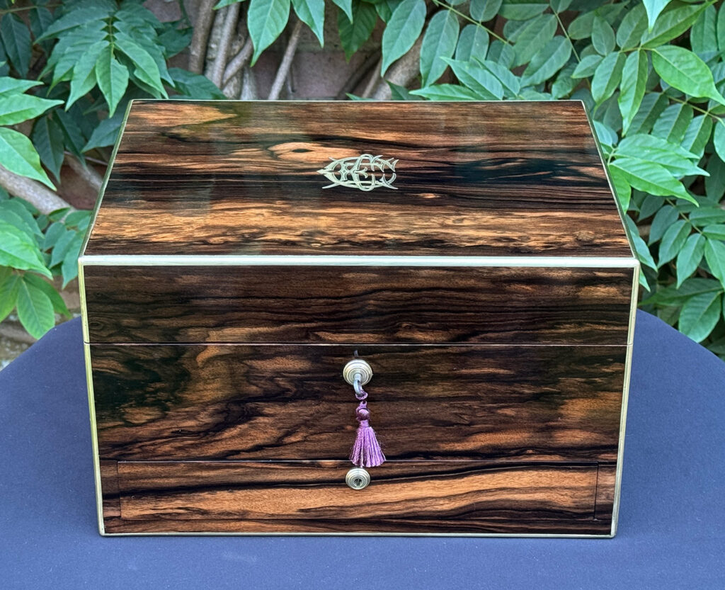 Front view of an Antique Jewellery Box in Coromandel by Pittway Brothers.