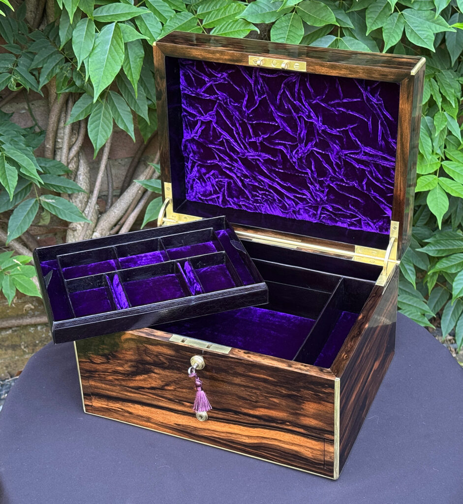 Front right open view of an Antique Jewellery Box in Coromandel by Pittway Brothers with tray removed.