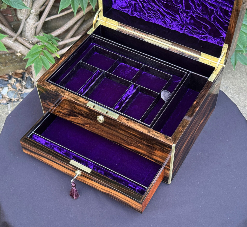 Overhead internal view of an Antique Jewellery Box in Coromandel by Pittway Brothers with lower drawer open.