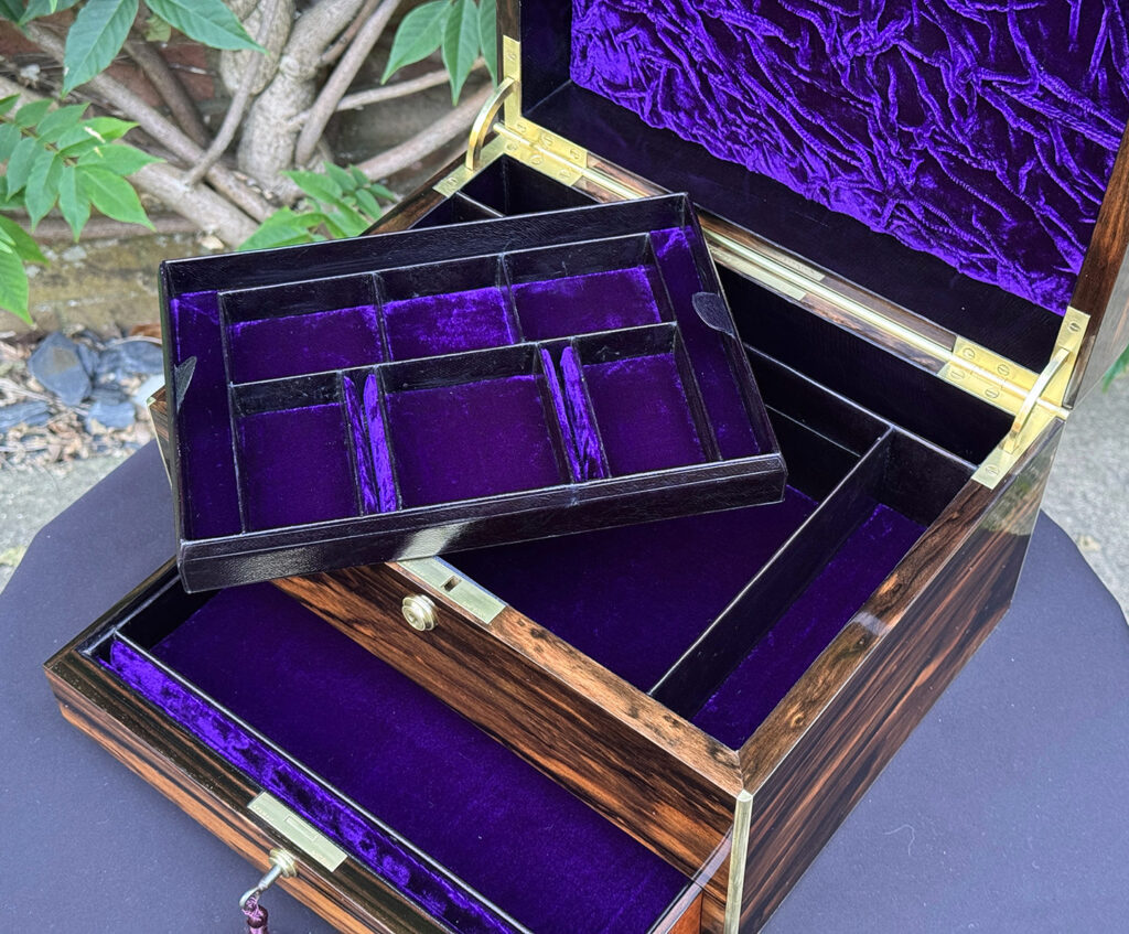 Overhead internal view of an Antique Jewellery Box in Coromandel by Pittway Brothers with tray removed.