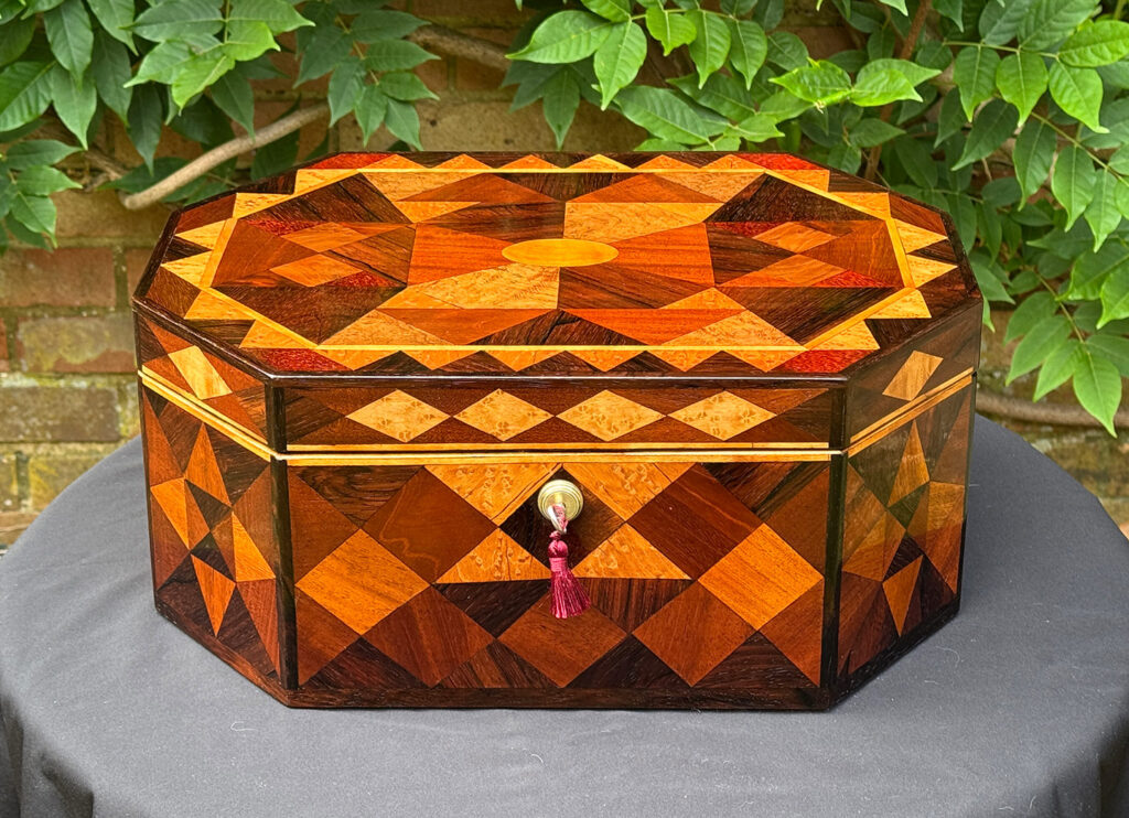 Front view of a Large Antique Octagonal Jewellery Box with Parquetry Inlay.
