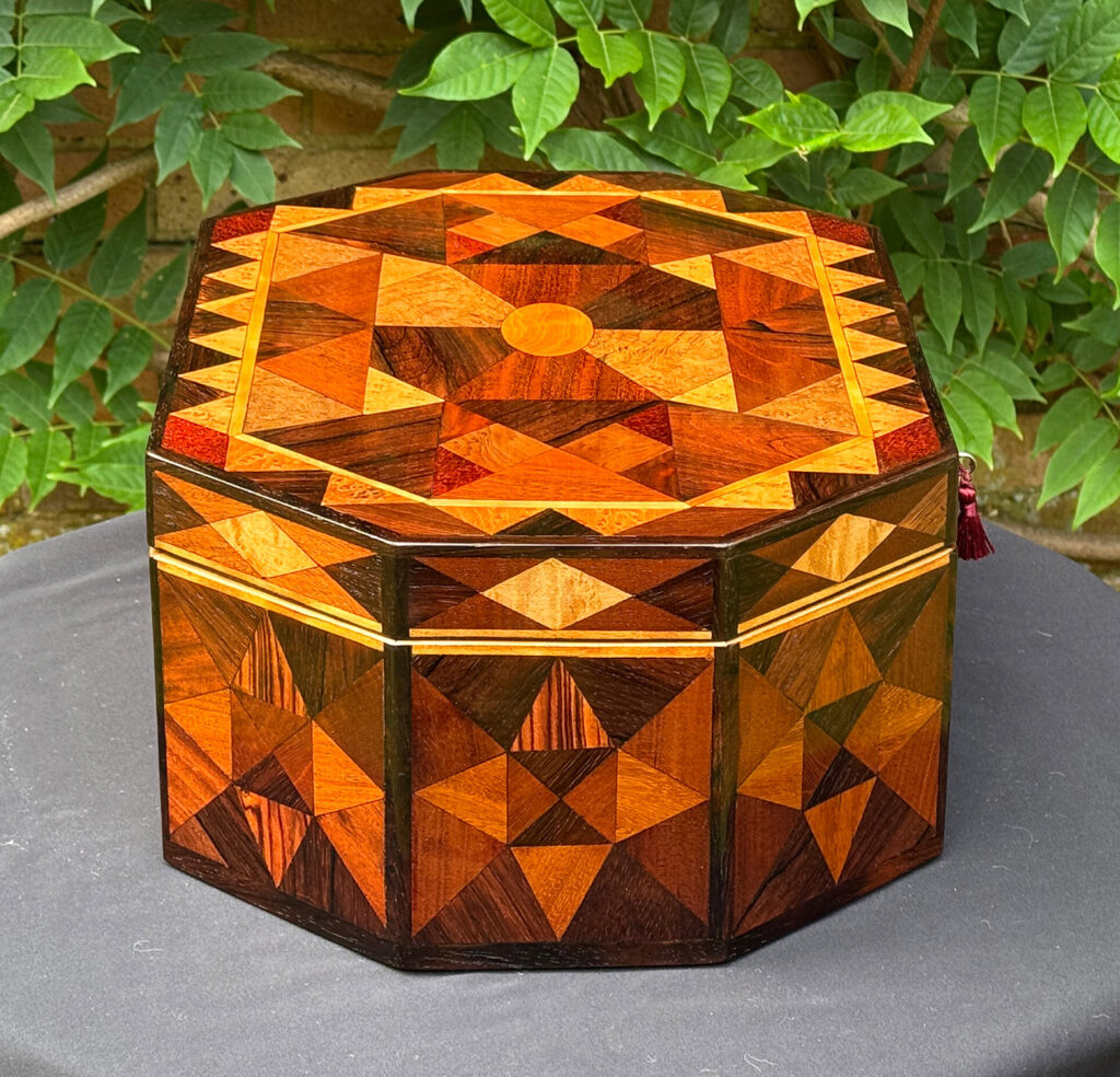 Left side view of a Large Antique Octagonal Jewellery Box with Parquetry Inlay.