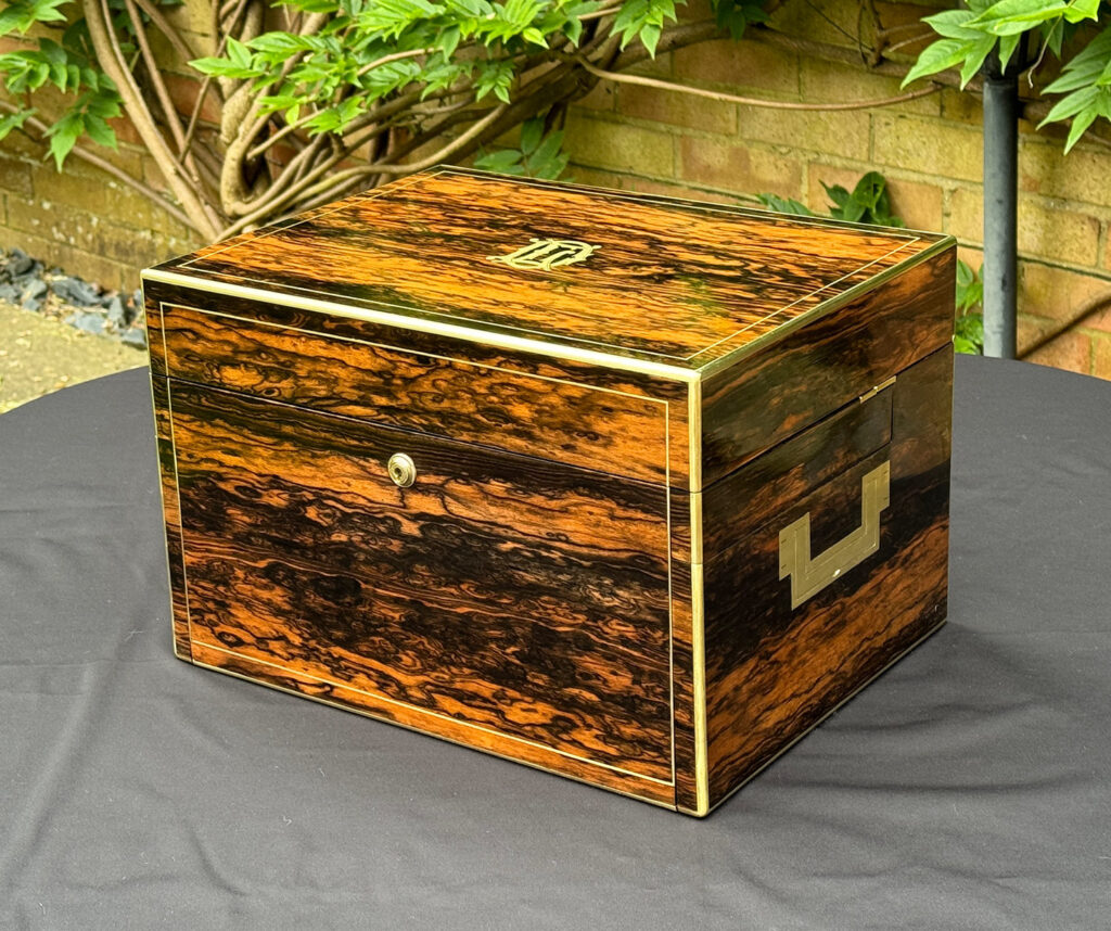 Front right view of a Large Antique Jewellery Box in Coromandel with Cantilever Mechanism.