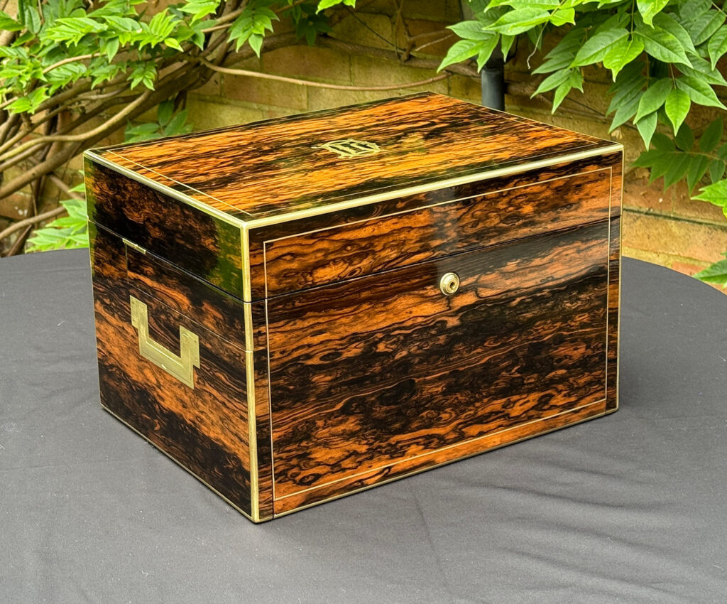 Rear left view of a Large Antique Jewellery Box in Coromandel with Cantilever Mechanism.