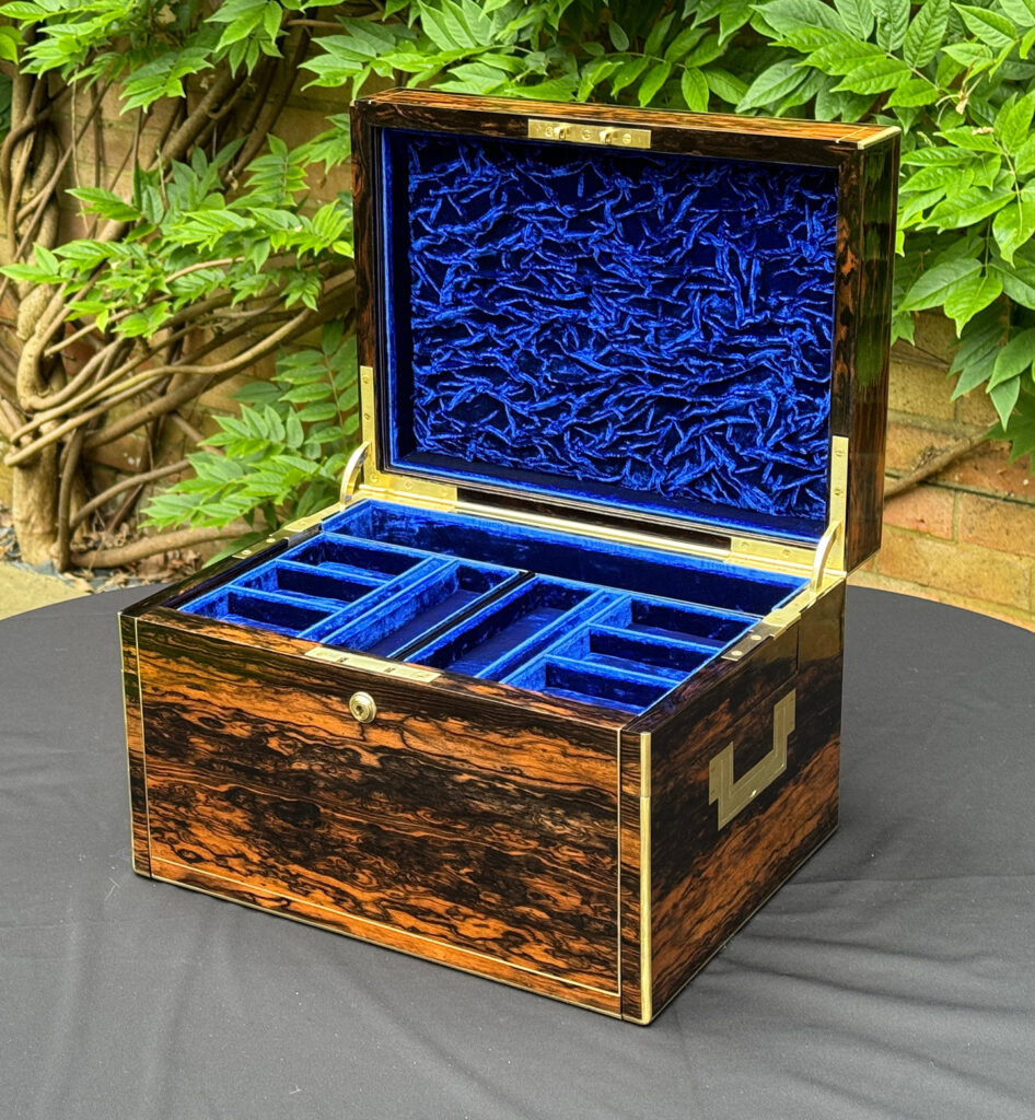Front right internal view of a Large Antique Jewellery Box in Coromandel with Cantilever Mechanism.