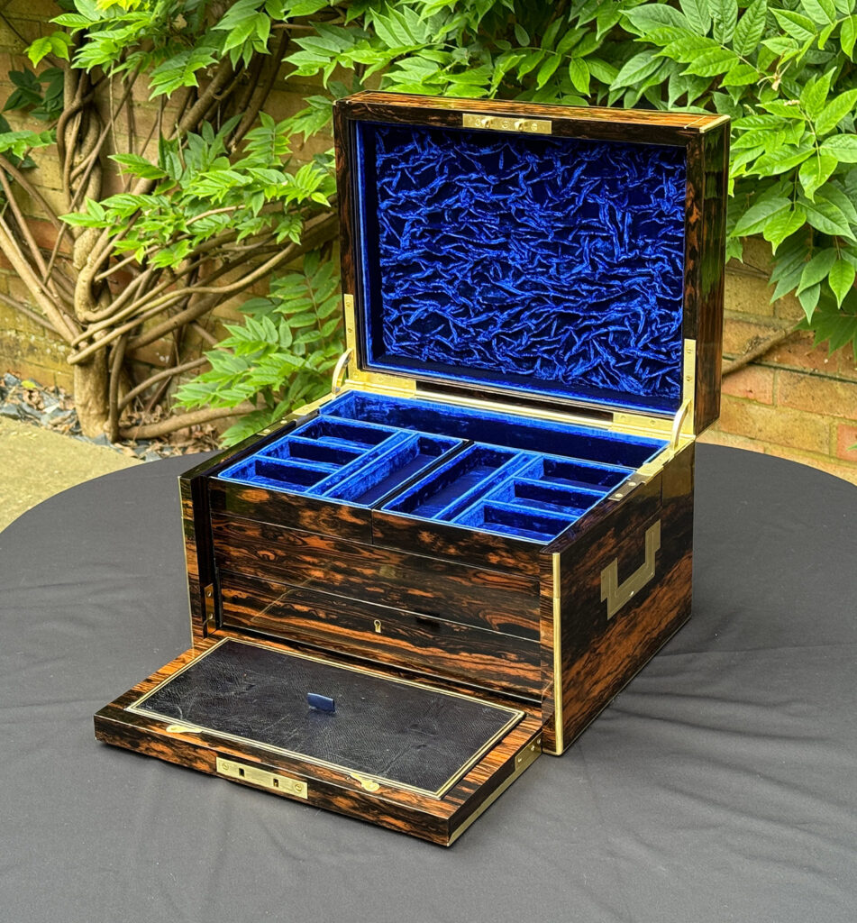 Front right open view of a Large Antique Jewellery Box in Coromandel with Cantilever Mechanism with front flap open.