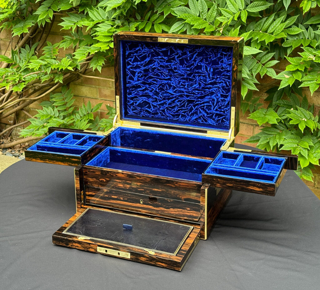 Front right internal view of a Large Antique Jewellery Box in Coromandel with Cantilever Mechanism with side trays opened.