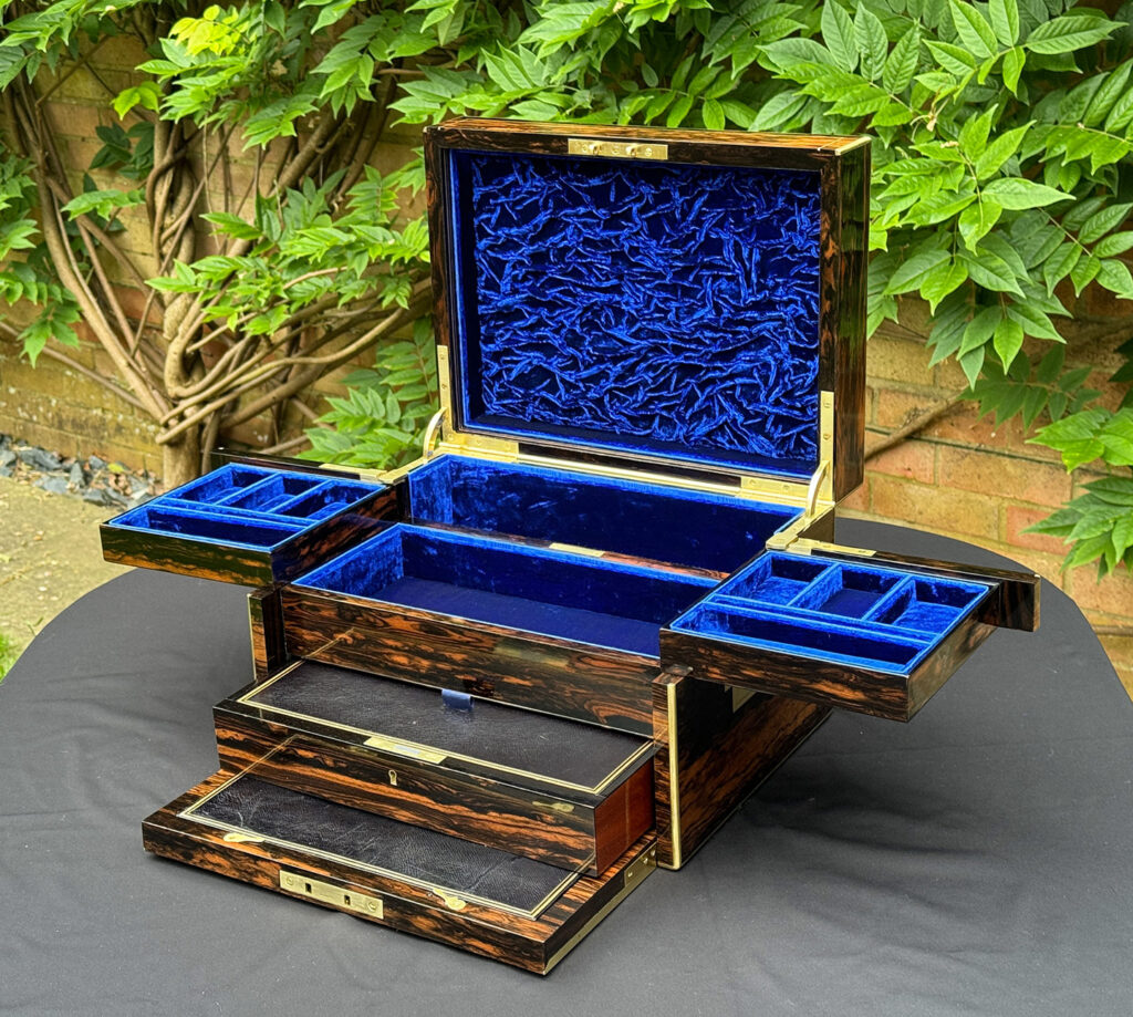 Front right internal view of a Large Antique Jewellery Box in Coromandel with Cantilever Mechanism with side trays and lower drawer opened.