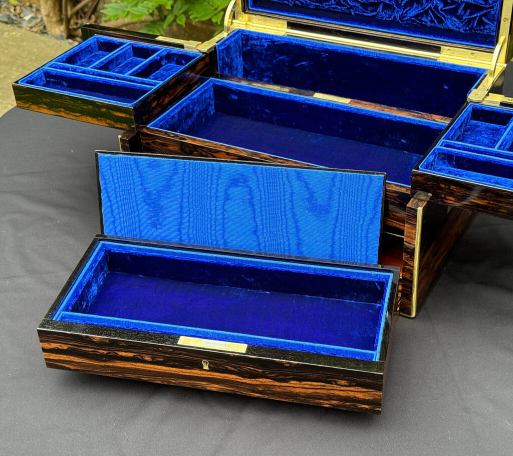 Close up view of lower drawer with lid removed from a Large Antique Jewellery Box in Coromandel with Cantilever Mechanism.