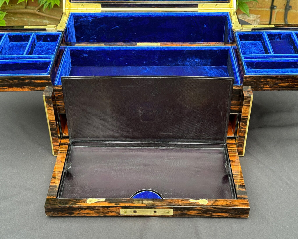 Close up view of front flap with lid raised from  a Large Antique Jewellery Box in Coromandel with Cantilever Mechanism.