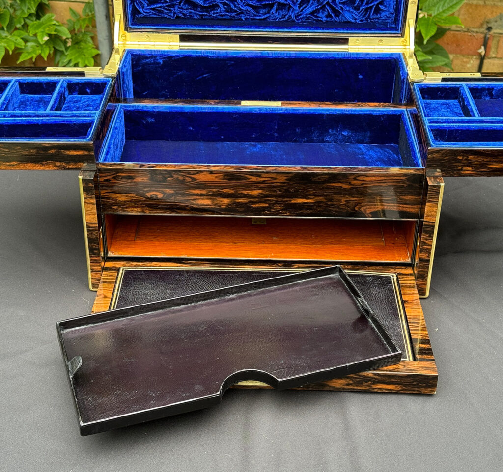 Close up view of front flap with fitted tray removed from a Large Antique Jewellery Box in Coromandel with Cantilever Mechanism.