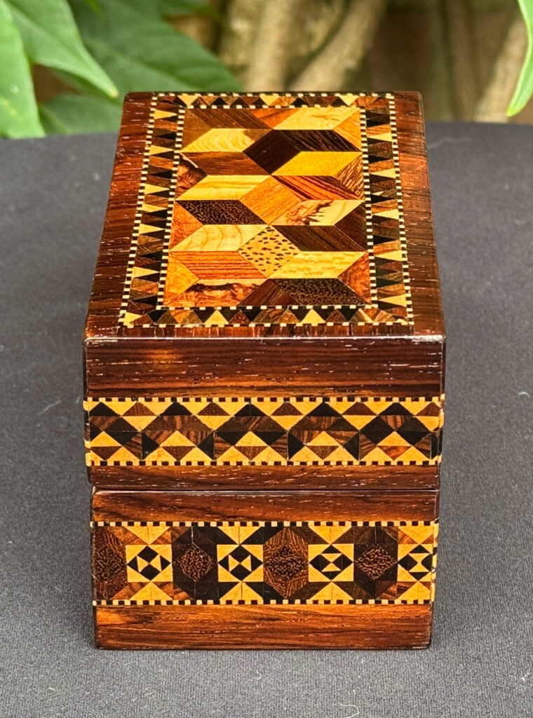 Left side view of an  Antique Miniature Jewellery Box with Parquetry Inlay.