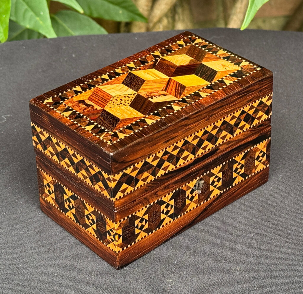 Front left view of an Antique Miniature Jewellery Box with Parquetry Inlay.