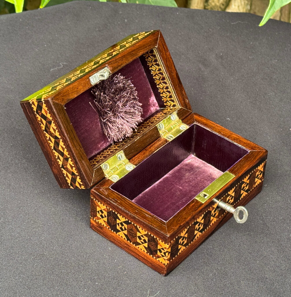Left overhead internal view of an Antique Miniature Jewellery Box with Parquetry Inlay.