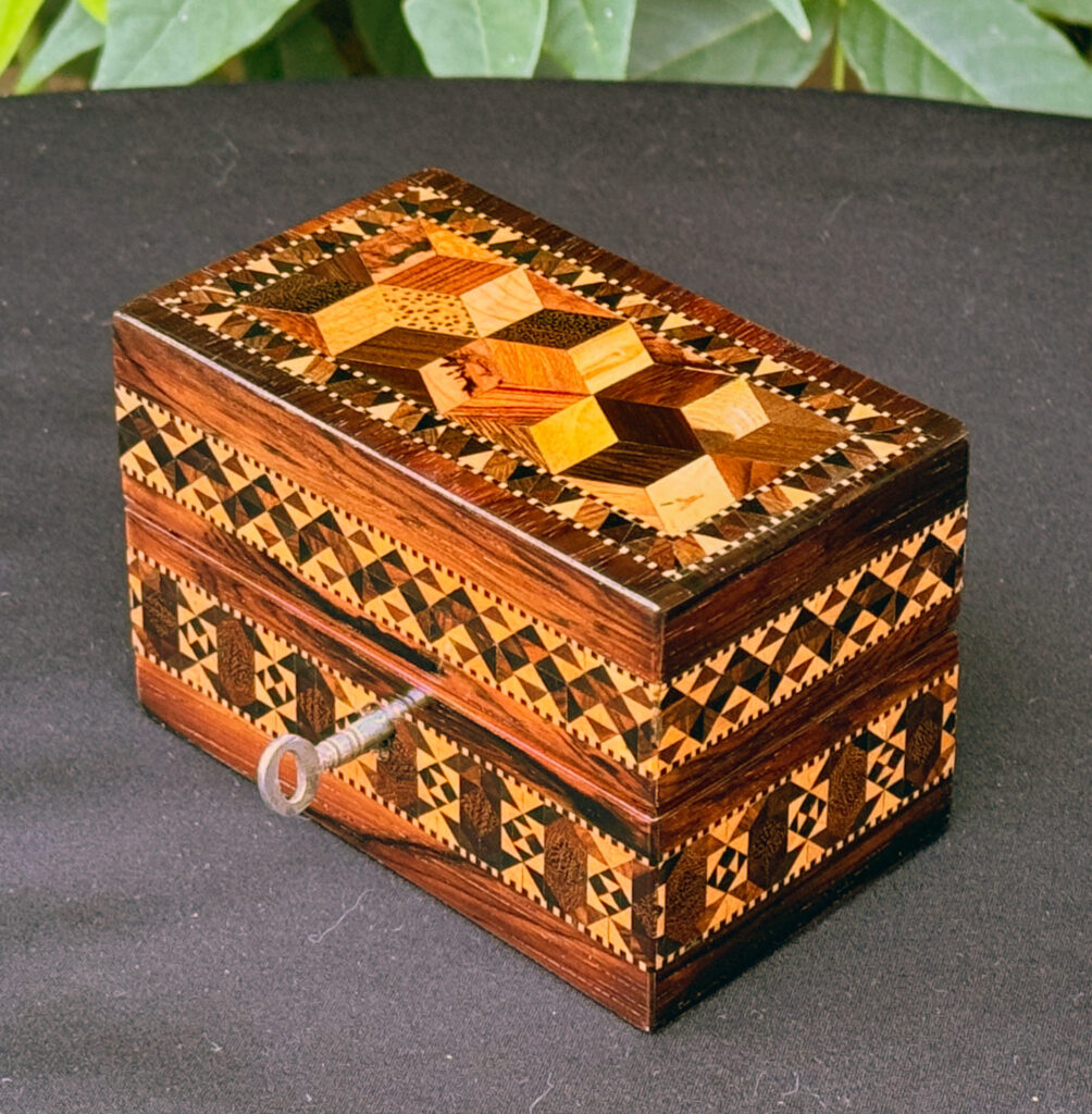 Front right overhead view of an Antique Miniature Jewellery Box with Parquetry Inlay.