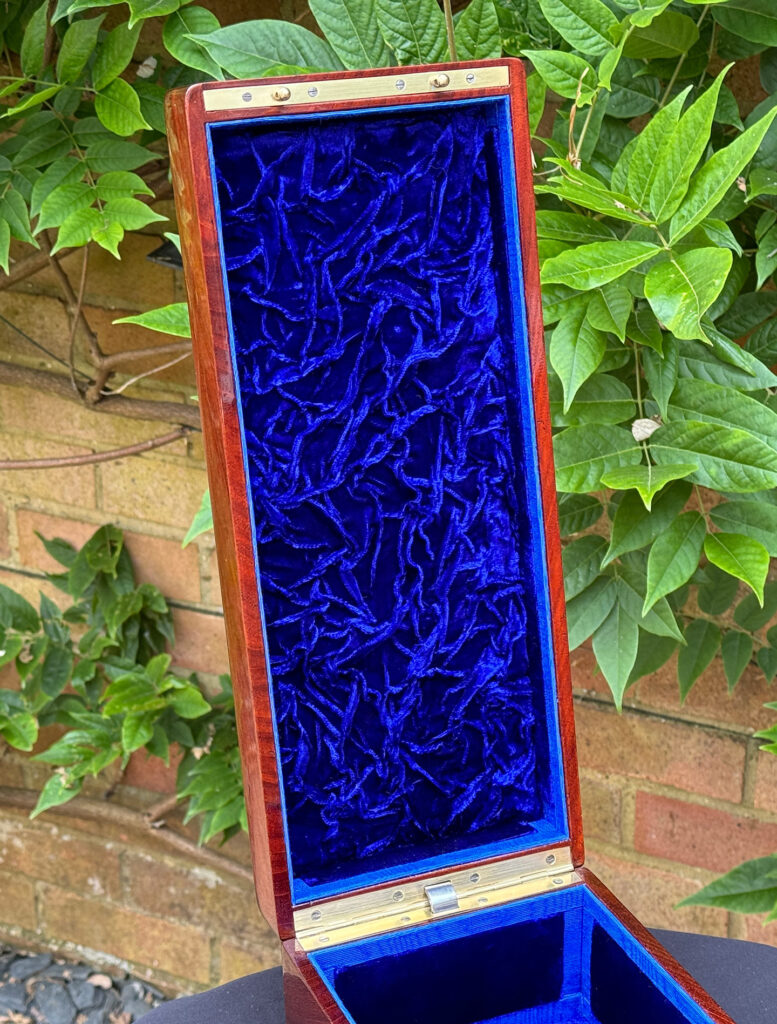 Close up of velvet ruching from a French Antique Travelling Jewellery in Mahogany, by Aucoc Ainé.