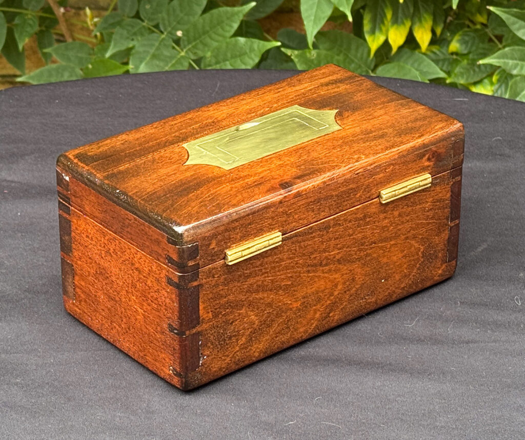 Rear right view of a Miniature Antique Jewellery Box in Mahogany with Bramah Lock.