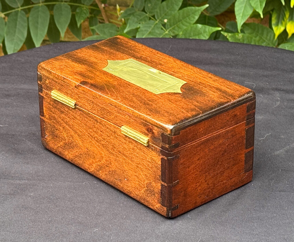 Rear left view of a Miniature Antique Jewellery Box in Mahogany with Bramah Lock.