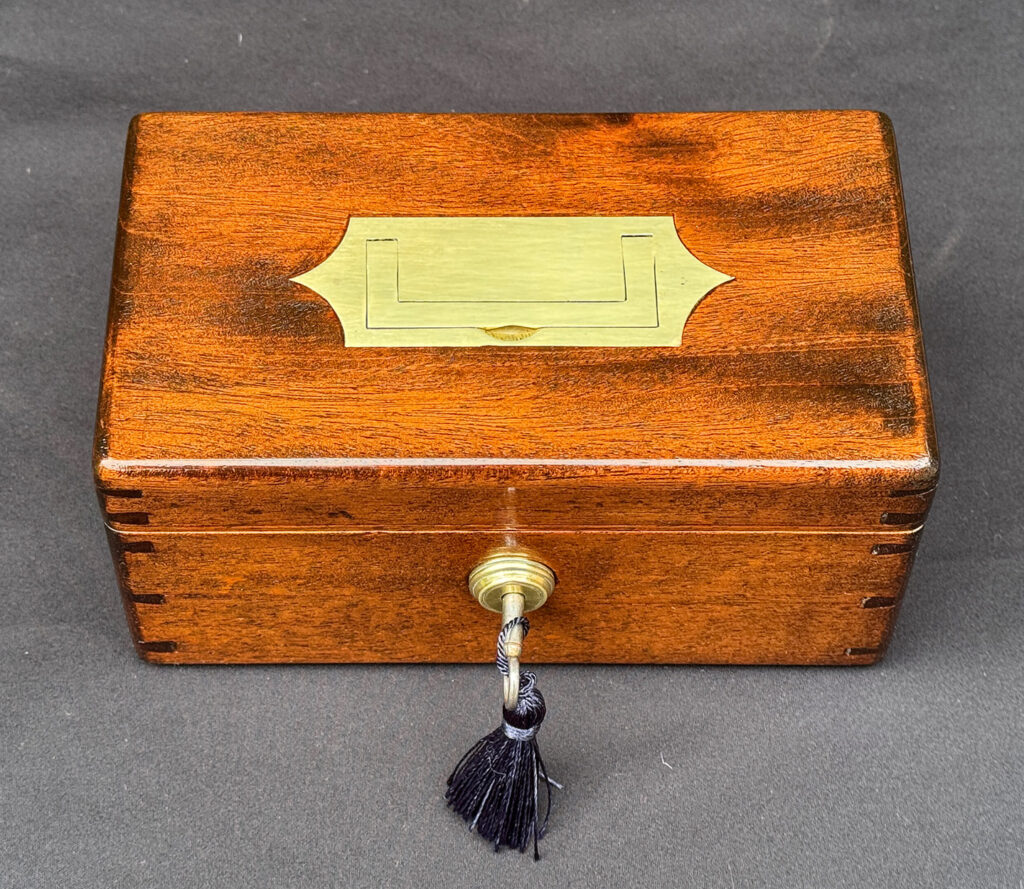 Overhead view of a Miniature Antique Jewellery Box in Mahogany with Bramah Lock.