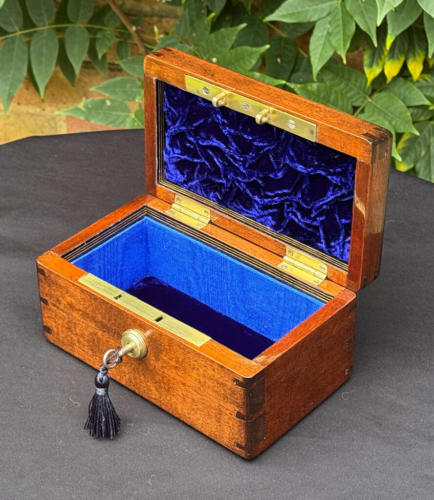 Front right internal view of a Miniature Antique Jewellery Box in Mahogany with Bramah Lock.