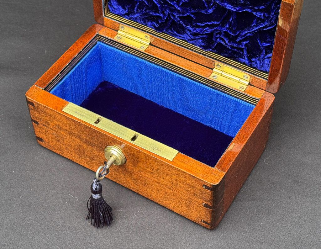 Overhead internal view of a Miniature Antique Jewellery Box in Mahogany with Bramah Lock.
