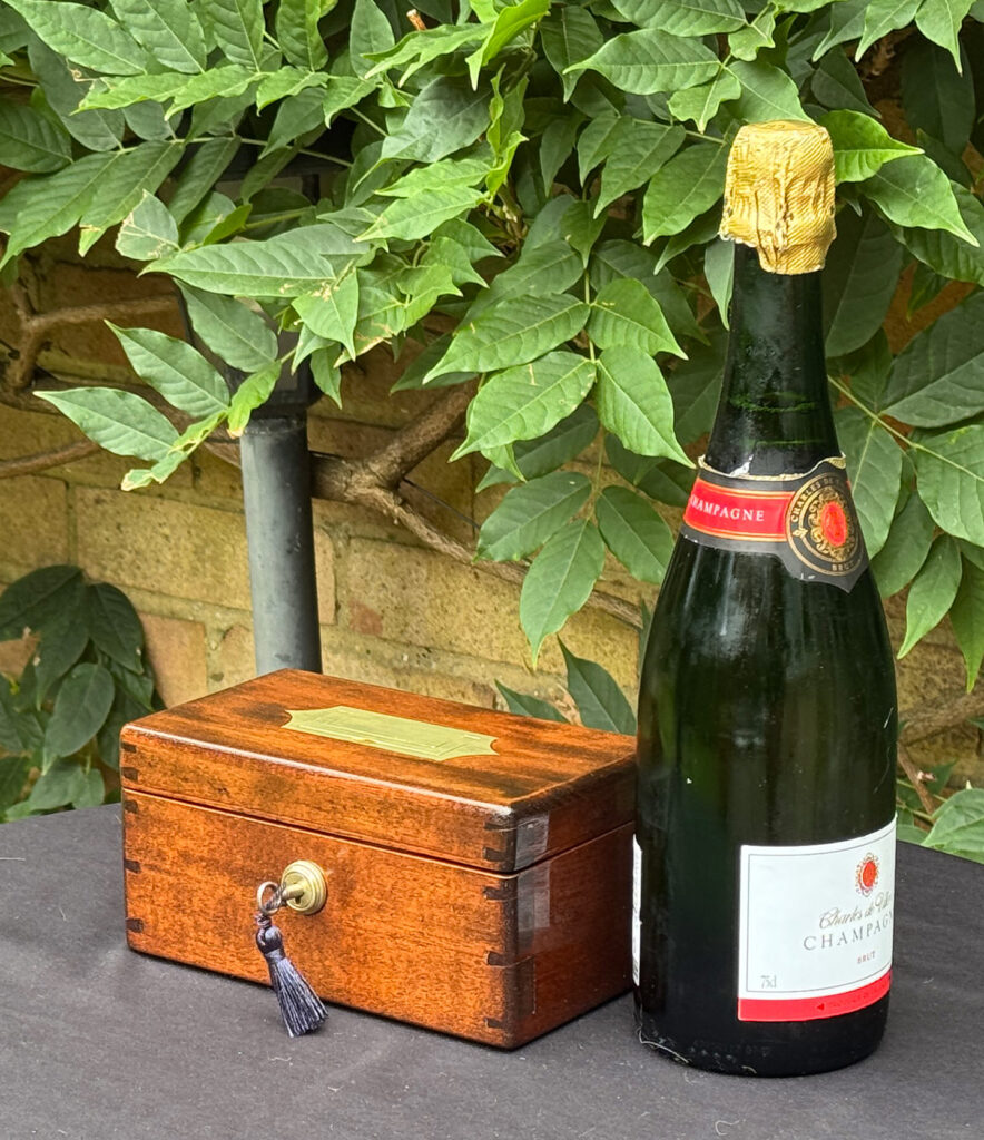 Size comparison of a Miniature Antique Jewellery Box in Mahogany with Bramah Lock.