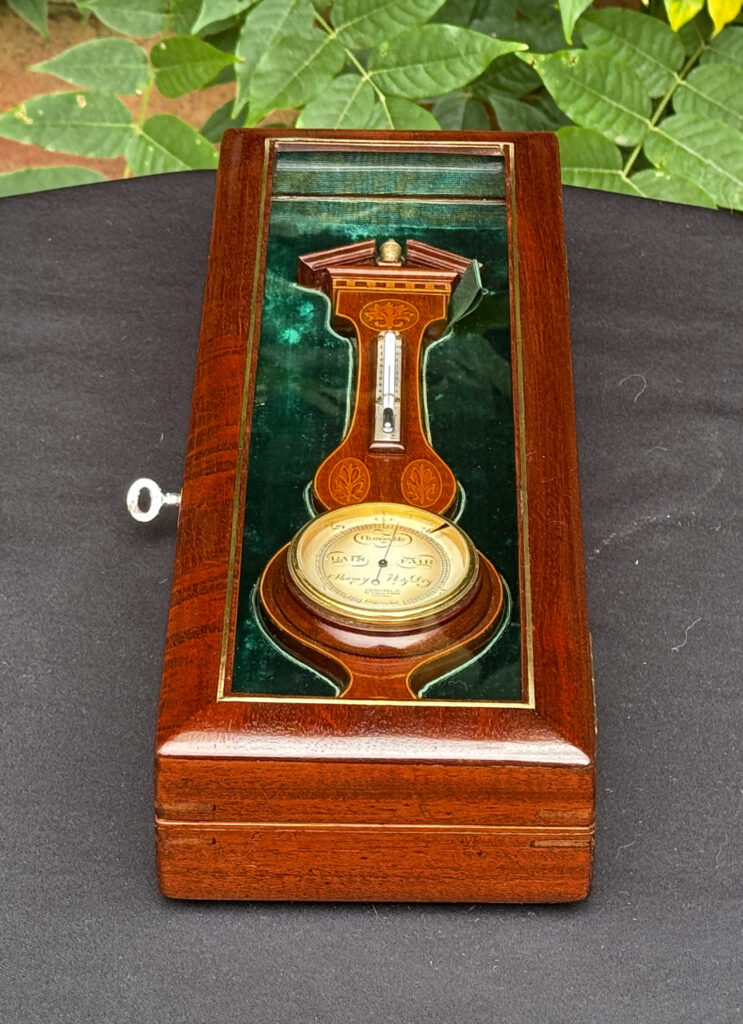 Right side view of an Antique Salesman Sample Miniature 9.5” Barometer in Original Display Case.