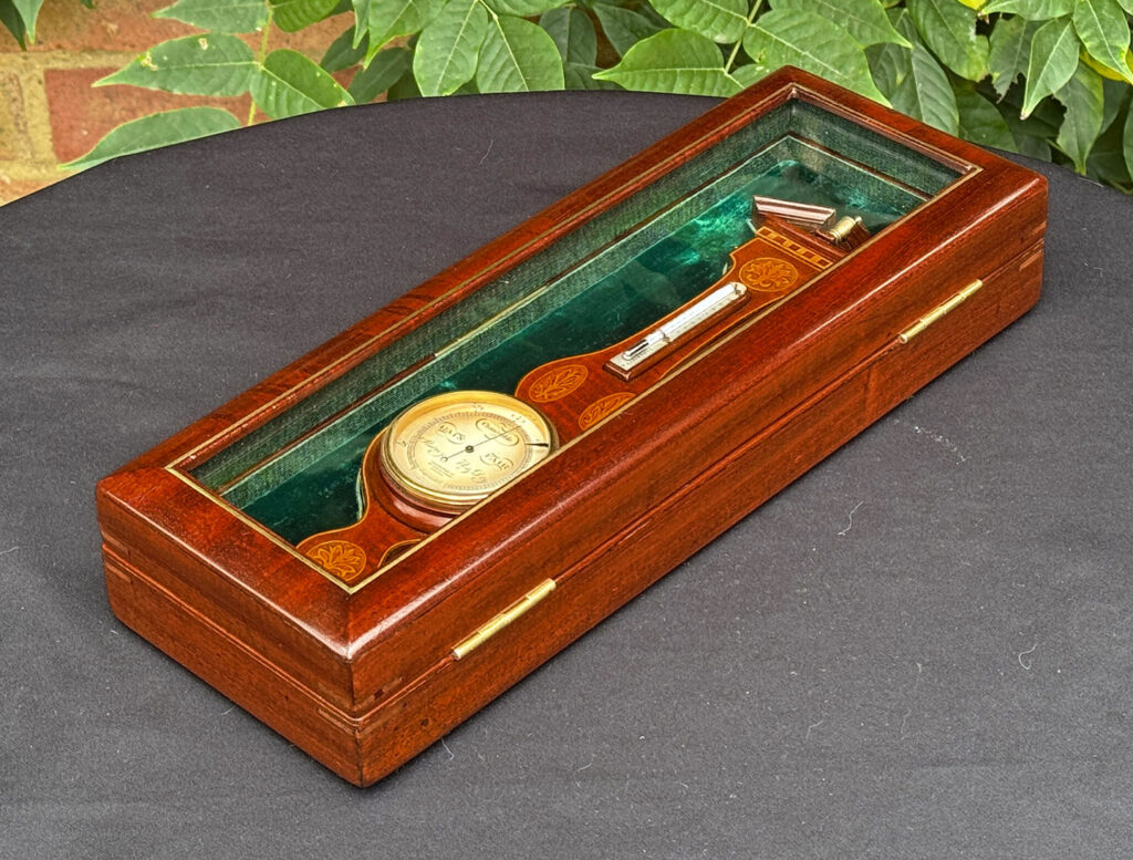 Rear right view of an Antique Salesman Sample Miniature 9.5” Barometer in Original Display Case.