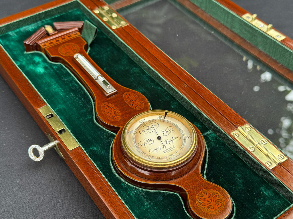 Right side semi-close up view of an Antique Salesman Sample Miniature 9.5” Barometer in Original Display Case.