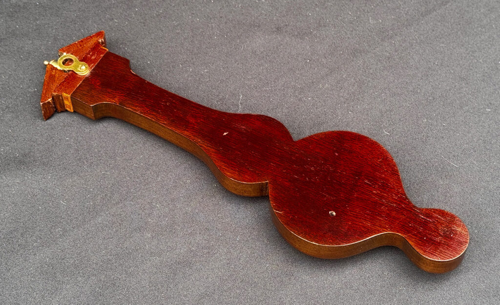 Rear casing of an Antique Salesman Sample Miniature 9.5” Barometer.
