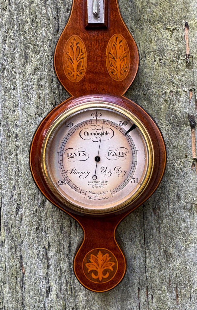 Semi-close up view of the main dial from an Antique Salesman Sample Miniature 9.5” Barometer.