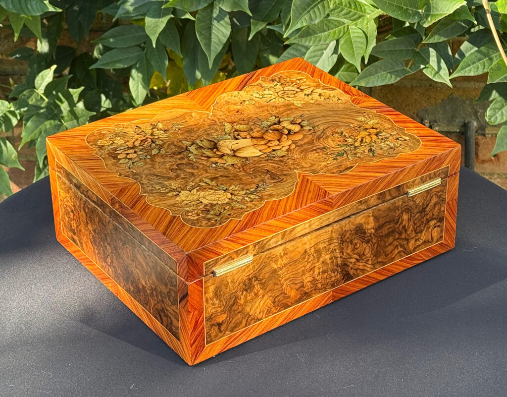 Rear right view of an antique Georgian jewellery box in burr walnut & kingwood with floral marquetry inlay.
