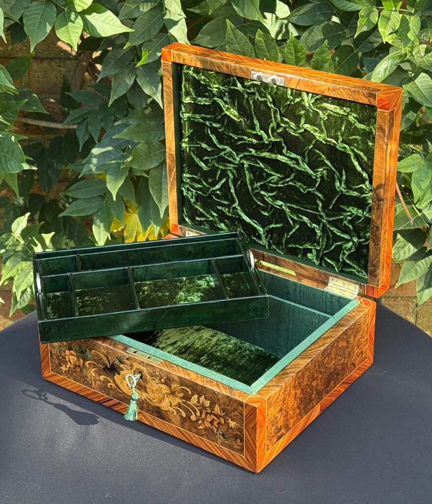 Front right internal view of an antique Georgian jewellery box in burr walnut & kingwood with floral marquetry inlay with tray removed.
