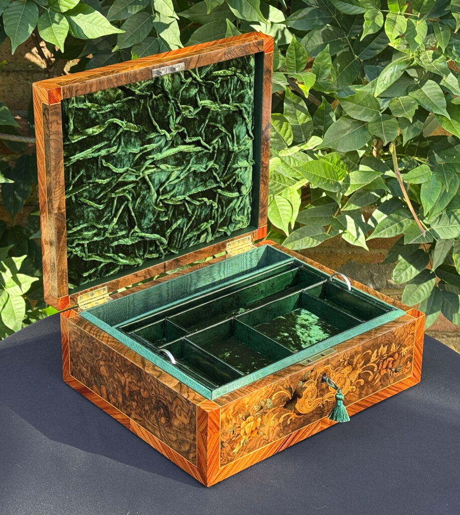 Front left internal view of an antique Georgian jewellery box in burr walnut & kingwood with floral marquetry inlay.