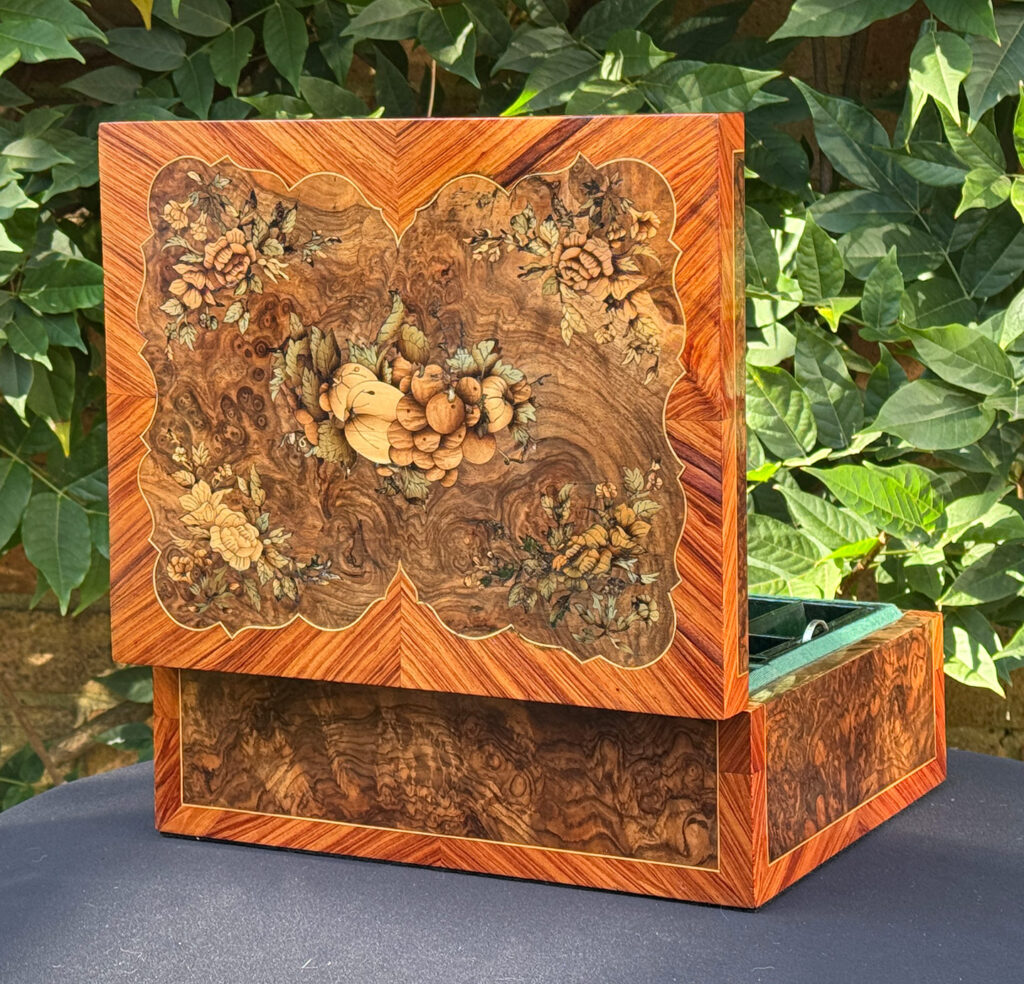 Rear left opened view of an antique Georgian jewellery box in burr walnut & kingwood with floral marquetry inlay.