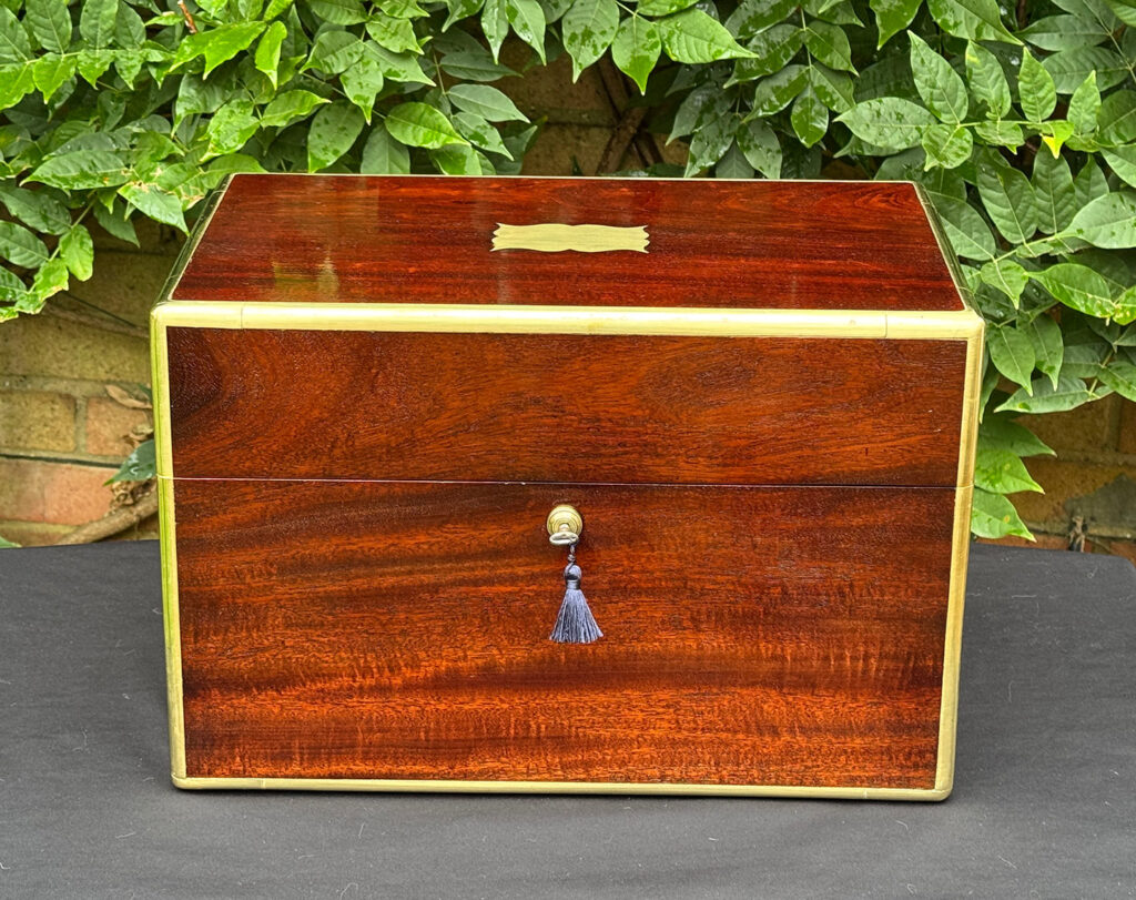 Front view of a large antique gentleman’s travelling jewellery box in Cuban mahogany.