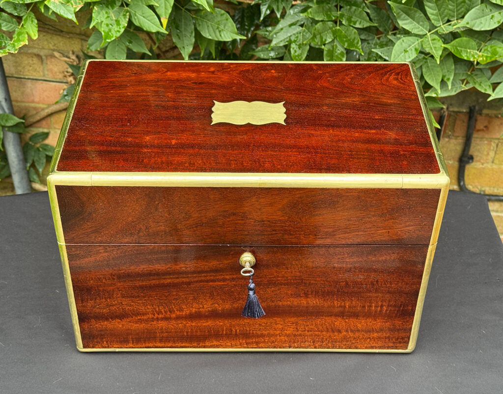 Overhead view of a large antique gentleman’s travelling jewellery box in Cuban mahogany.