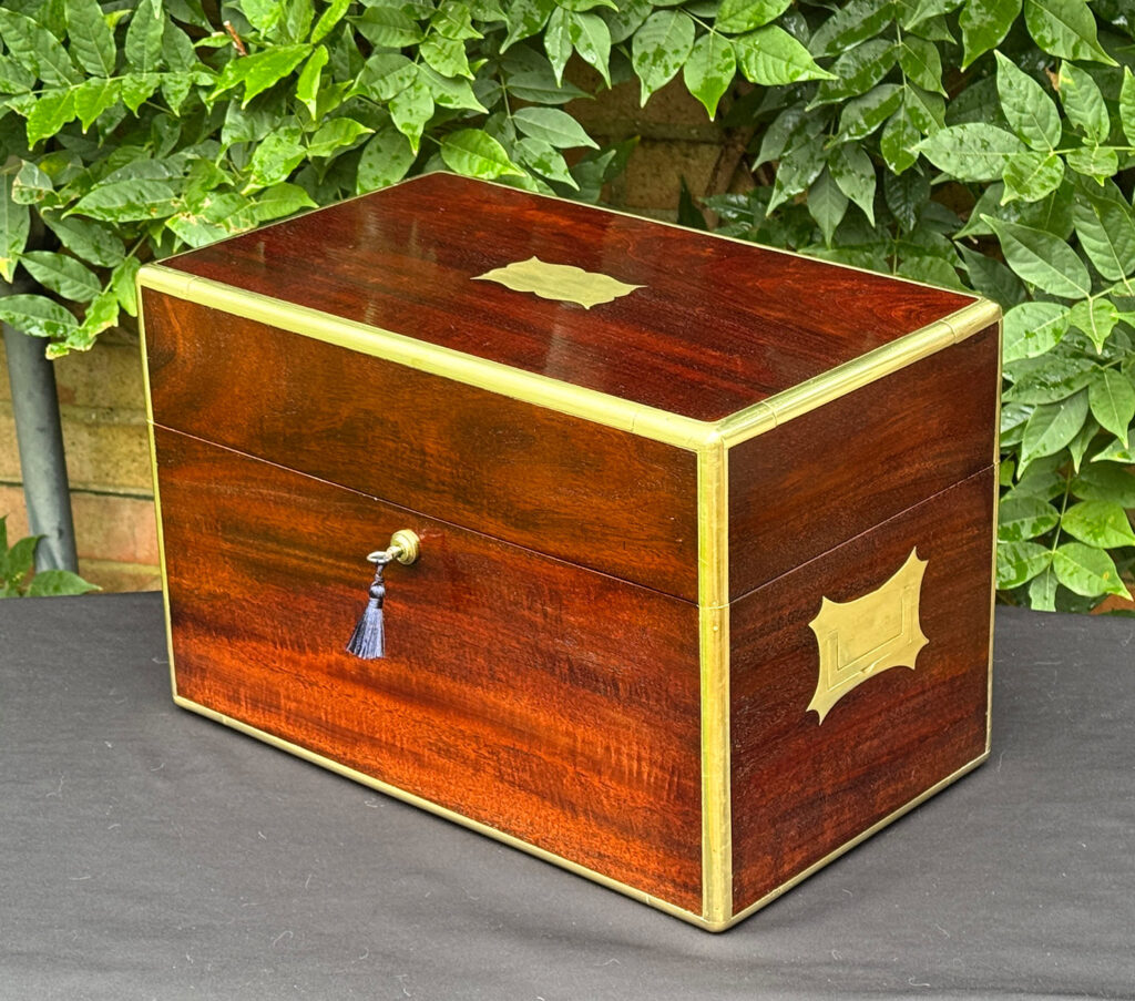 Front right view of a large antique gentleman’s travelling jewellery box in Cuban mahogany.