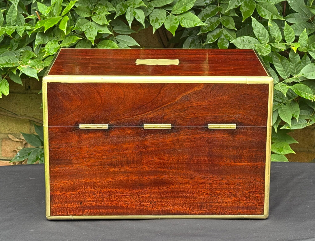 Rear view of a large antique gentleman’s travelling jewellery box in Cuban mahogany.