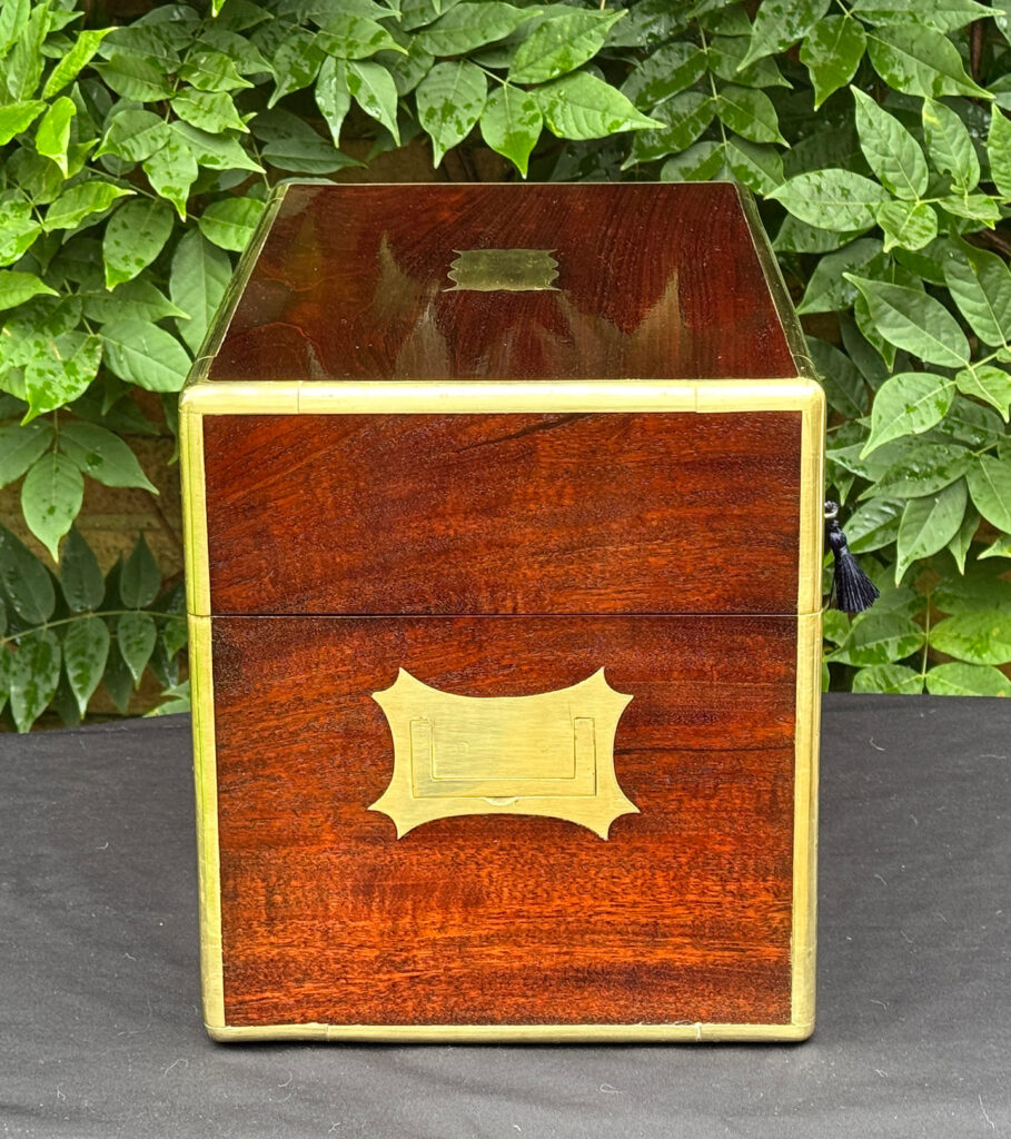 Right side view of a large antique gentleman’s travelling jewellery box in Cuban mahogany.