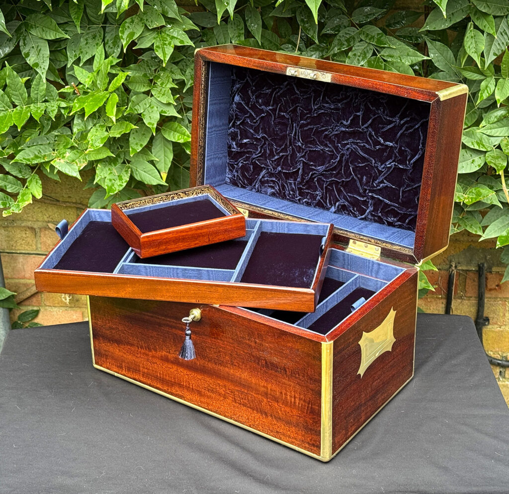 Front right internal view of a large antique gentleman’s travelling jewellery box in Cuban mahogany with two trays removed.