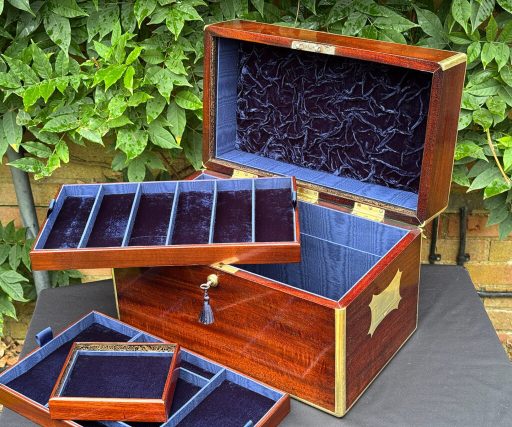 View of the second tray removed from a large antique gentleman’s travelling jewellery box in Cuban mahogany.