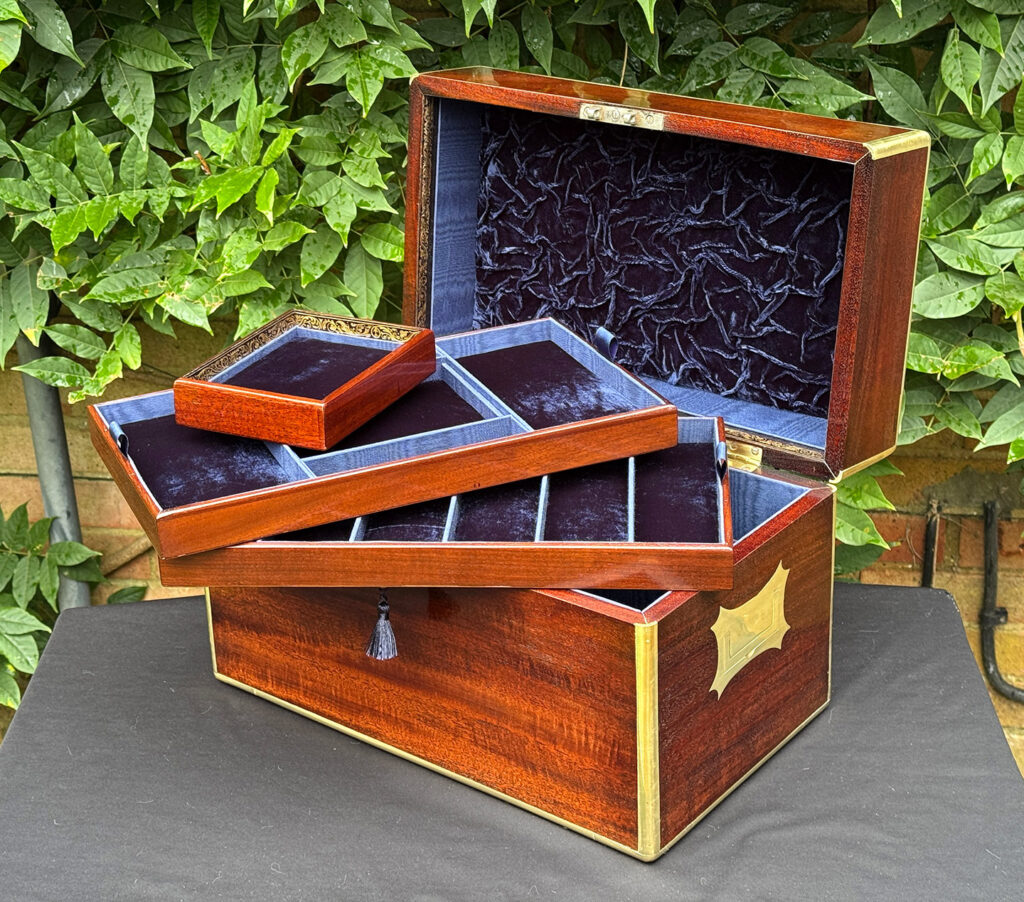 View of a large antique gentleman’s travelling jewellery box in Cuban mahogany with all three trays removed.