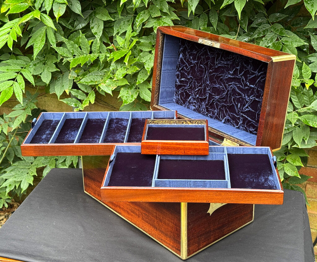 View of a large antique gentleman’s travelling jewellery box in Cuban mahogany with all three trays removed.