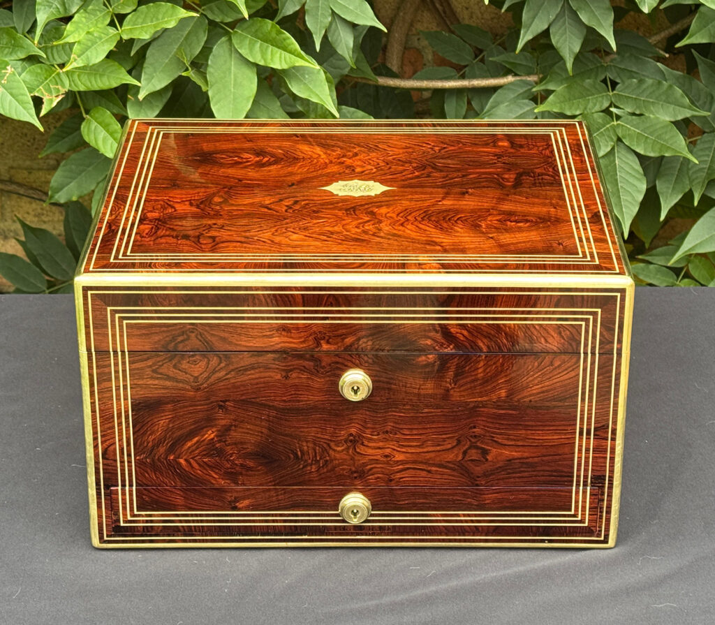 Front view of an antique jewellery box in kingwood, by Halstaff & Hannaford.